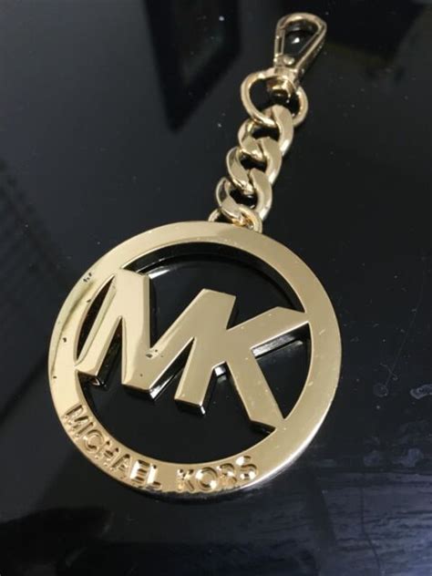 michael kors emblem replacement